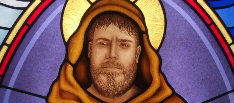 Stained glass window featuring Saint Francis Face