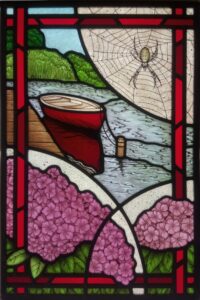 Stained glass with red boat and wasp spider