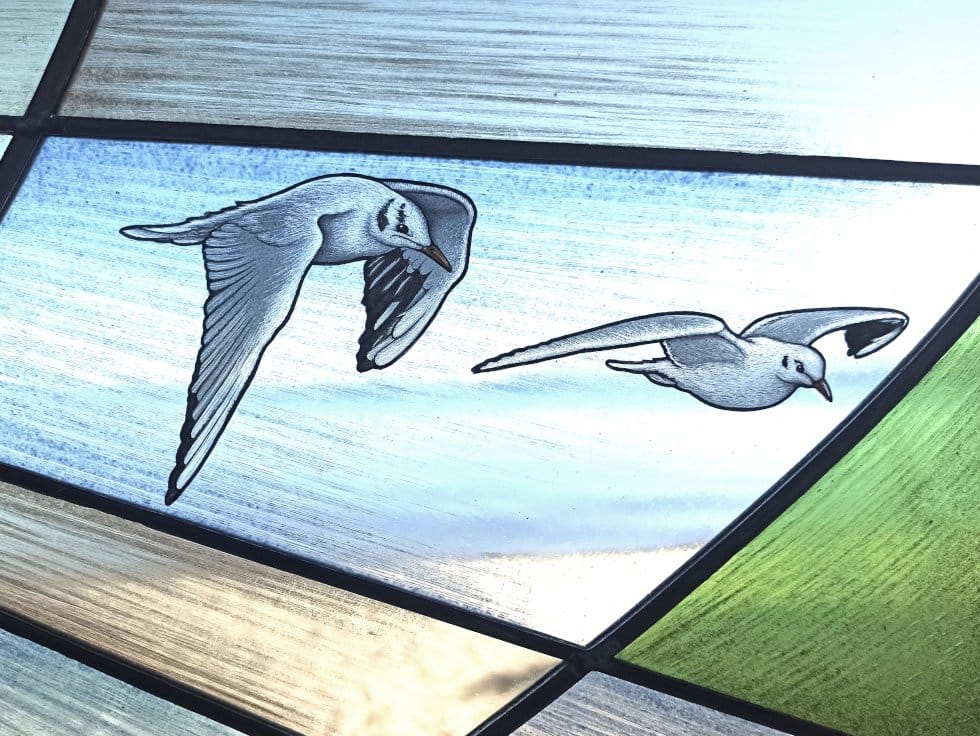 Modern stained glass with the lake seagull