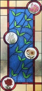 Stained glass window with flowers for a door