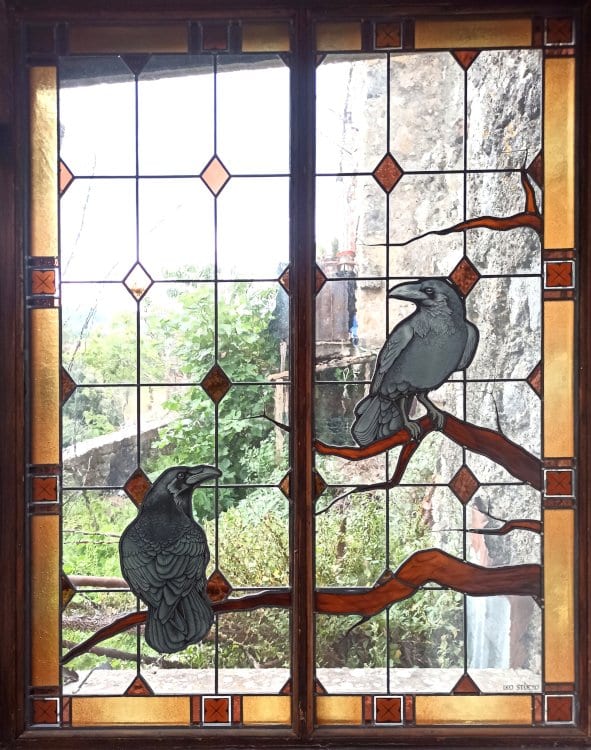 stained glass windows with crows