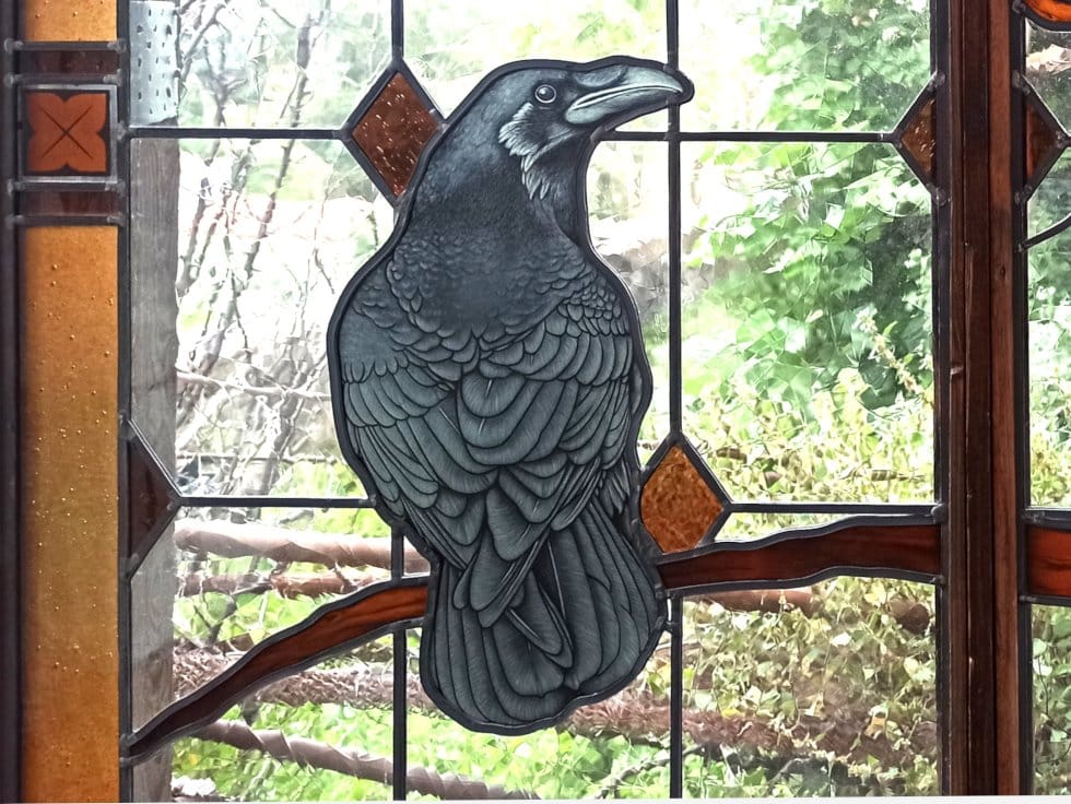 Stained glass, crow painted on glass